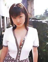 Young asian teen Risa Shimamoto posing and spreading outdoors